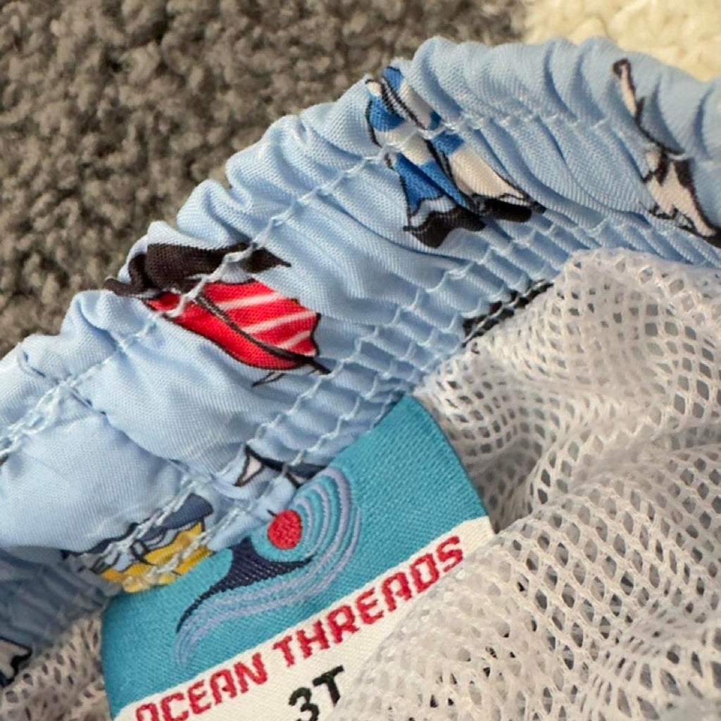 3 assorted pack of boys swim trunks with sailboats, stars, stripes, and sharks. Size 4-6 years. #swimwear #boys - Image 4