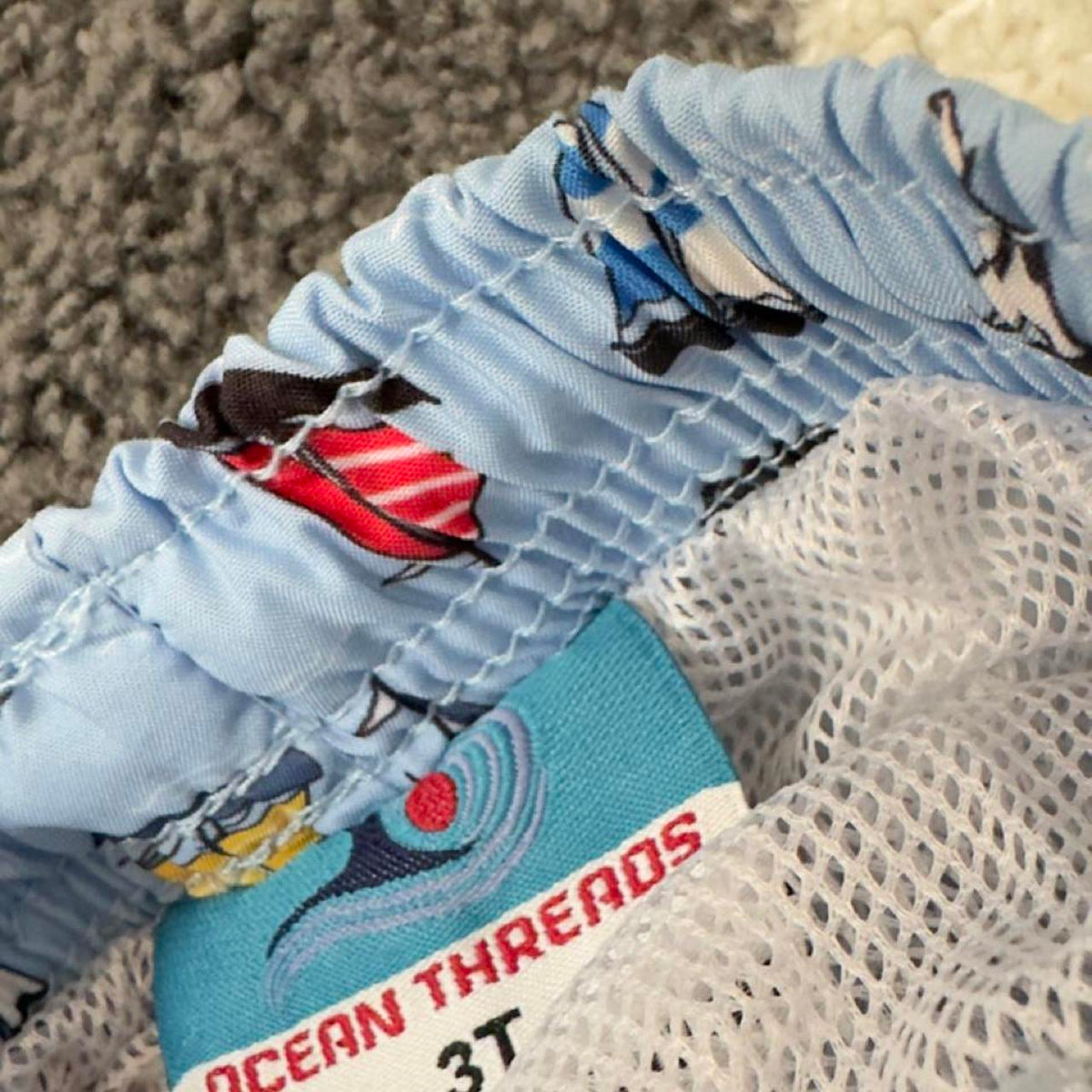 3 assorted pack of boys swim trunks with sailboats, stars, stripes, and sharks. Size 4-6 years. #swimwear #boys - Image 4